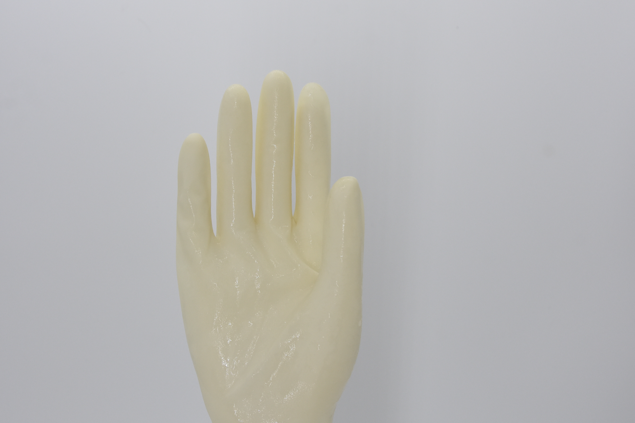 Gant chirurgical en latex biodégradable à usage unique pour la